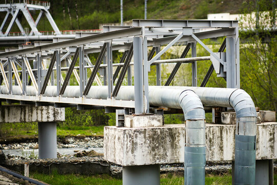 Long and winding the pipeline on the bridge over the river