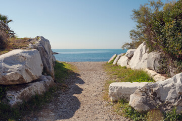 Fototapeta na wymiar Dirt path leading to the Mediterranean Sea