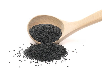 Black sesame seeds pile in wooden spoon isolated on white background