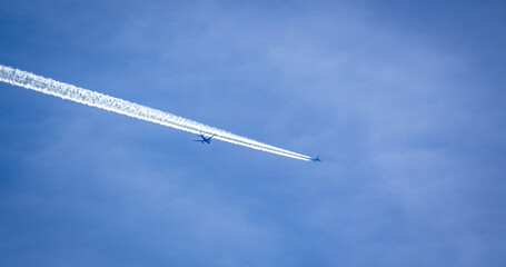 Planes cross in the sky