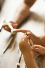 boy with dad holding paint brushes