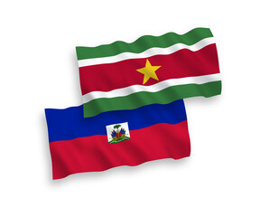 Flags of Republic of Haiti and Republic of Suriname on a white background