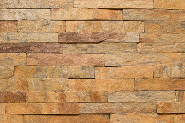 Seamless texture, construction and design. Brown brick masonry stone. Stone wall background. Facing stone.