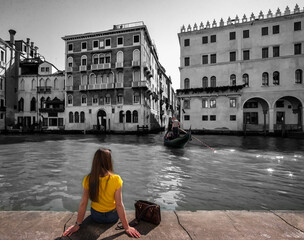 Morning in Venice on the bank of the canal. The figure of a girl. Italy Veneto.