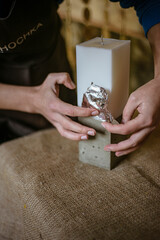 process of making a rectangular candle from cement, small business concept at home, silver leaf on candles