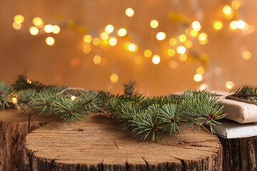 Christmas background with natural wood scene and defocus lights. Rustic composition with fir...