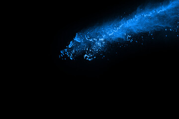 Fototapeta premium abstract blue powder splatted background,Freeze motion of color powder exploding/throwing color powder,color glitter texture on black background.
