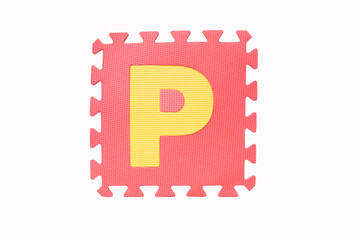 Jigsaw English 'P" yellow pink foam alphabet puzzle pieces isolated on white background. Jigsaw box with character English alphabet letter "P"  English It is a universal language used all over world.