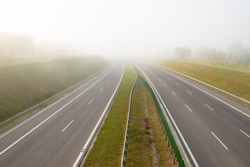 Calm highway on a foggy morning.