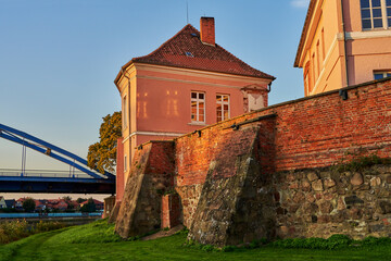 part of the former duke's castle in Hoya (Germany) with wall and one of the buildings in beautiful evening sunlight
