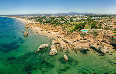 Obraz premium Aerial view of Praia dos Tres Irmaos beach, Alvor, Algarve, Portugal