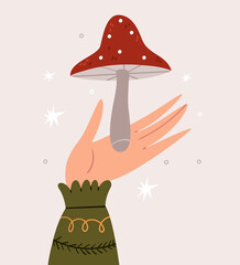 A hand in a warm sweater holds an amanita. Cute autumn illustration.