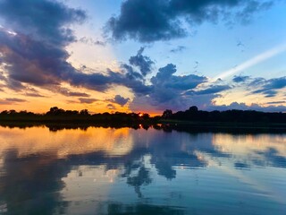painted sky sunset over the lake
