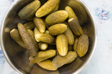 Appetizing pickles in a metal container. Pickled cucumbers.