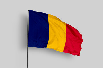 Chad flag isolated on the blue sky background. close up waving flag of Chad. flag symbols of Chad. Concept of Chad.