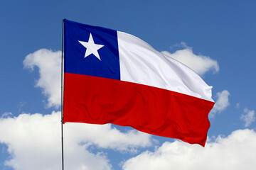 Chile flag isolated on the blue sky background. close up waving flag of Chile. flag symbols of Chile. Concept of Chile.