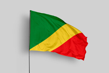 Congo flag isolated on the blue sky background. close up waving flag of Congo. flag symbols of Congo. Concept of Congo.