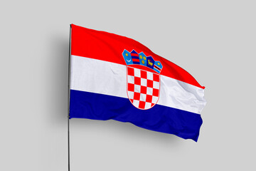 Croatia flag isolated on the blue sky background. close up waving flag of Croatia. flag symbols of Croatia. Concept of Croatia.