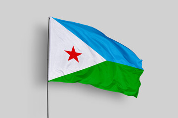 Djibouti flag isolated on the blue sky background. close up waving flag of Djibouti. flag symbols of Djibouti. Concept of Djibouti.