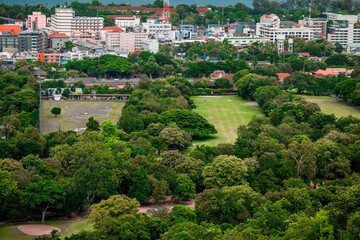 Obraz premium The view of the natural background of the mountain close-up, with blurred fog scattered in the rainy season or the humid climate, with beautiful green trees in the ecological system