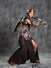 Fototapeta na wymiar Steampunk or post-apocalyptic style character, with an unusual cold weapon