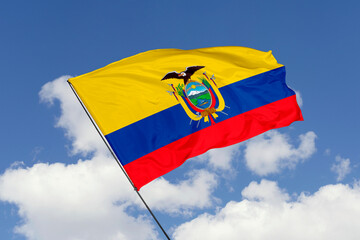 Ecuador flag isolated on the blue sky background. close up waving flag of Ecuador. flag symbols of Ecuador. Concept of Ecuador.