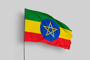 Ethiopia flag isolated on the blue sky background. close up waving flag of Ethiopia. flag symbols of Ethiopia. Concept of Ethiopia.