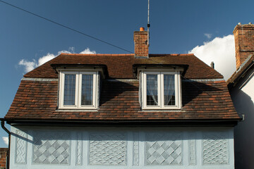 Facade of old colorful Tudor timber framed British cottages at Saffron Walden, England