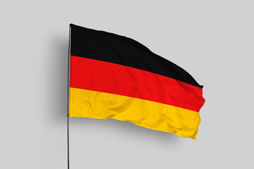 Germany flag isolated on the blue sky background. close up waving flag of Germany. flag symbols of Germany. Concept of Germany.