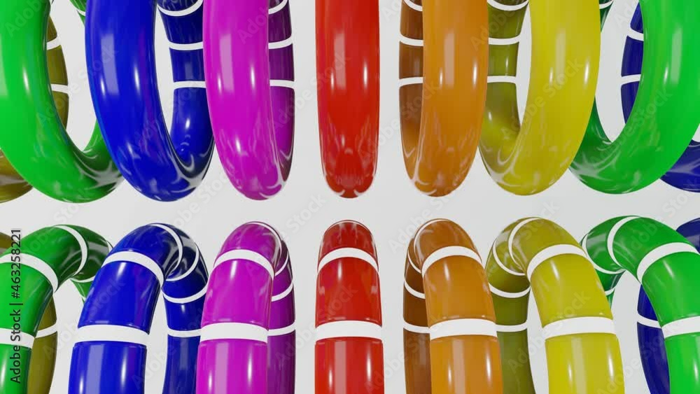 Poster rows of multicolored smooth rainbow rings with white cutouts rotate slowly against a white backgroun