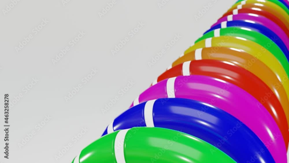 Poster rows of multicolored smooth rainbow rings with white cutouts rotate slowly against a white backgroun