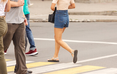 pedestrians walking on a crosswalk