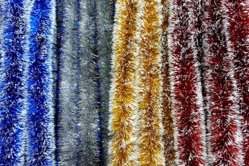 Colorful stripes of decorative Christmas garlands. 