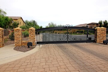 Metal Exit Gate On Pavers With Walk In Entrance
