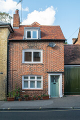 Old British brick house with green door at Saffron Walden, England