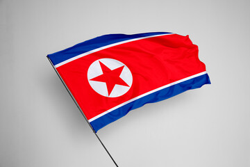 North Korea flag isolated on white background. close up waving flag of North Korea. flag symbols of North Korea. Concept of North Korea.