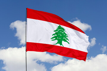 Lebanon flag isolated on the blue sky background. close up waving flag of Lebanon. flag symbols of Lebanon. Concept of Lebanon.