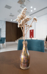 bouquet of dried flowers in a bottle