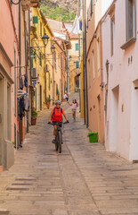 nice active woman exploring  the beautifull village of Rio Nell` Elba on the Island of Elba, Tuscan Arichipelago, Tuscany, Italy