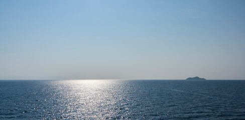 blueseascape in sparkling backlit in the italiean mediterranean sea