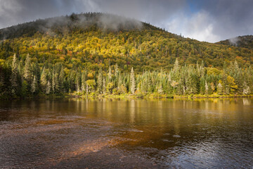 A River runs through Jacques-Cartier National Park in fall, Quebec, Canada