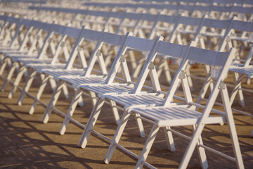 Rows of concert chairs for viewers on the street