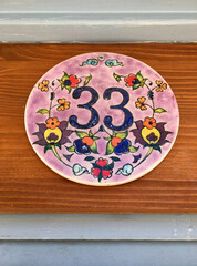 Close up of an house door number 33