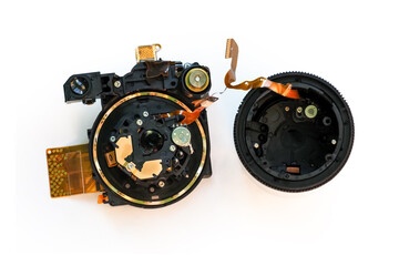 Disassembled lens of a digital camera isolated on white background. Lens image stabilization module