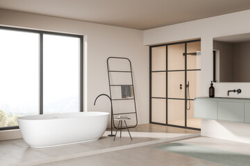 Fototapeta na wymiar Light bathroom interior with bathtub and window, sink and shower