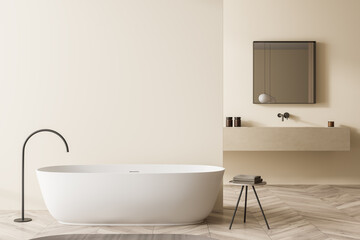 Fototapeta na wymiar Beige bathroom with oval white bathtub and square mirror