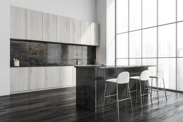 Modern black and white wood kitchen. Corner view.