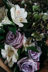 a bouquet of lilac roses, alstroemeria and dark hydrangea. a luxurious bouquet of noir