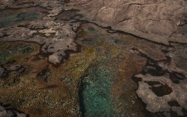 Gran Canaria, calm rock pools under steep cliffs of the north coast are 
separated from the ocean by volcanic rocks of platform  constructed by old lava flows
Punta de Galdar area