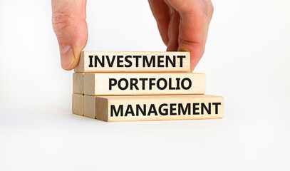 Investment portfolio management symbol. Concept words 'Investment portfolio management'. Businessman hand. Beautiful white background. Business, investment portfolio management concept, copy space.